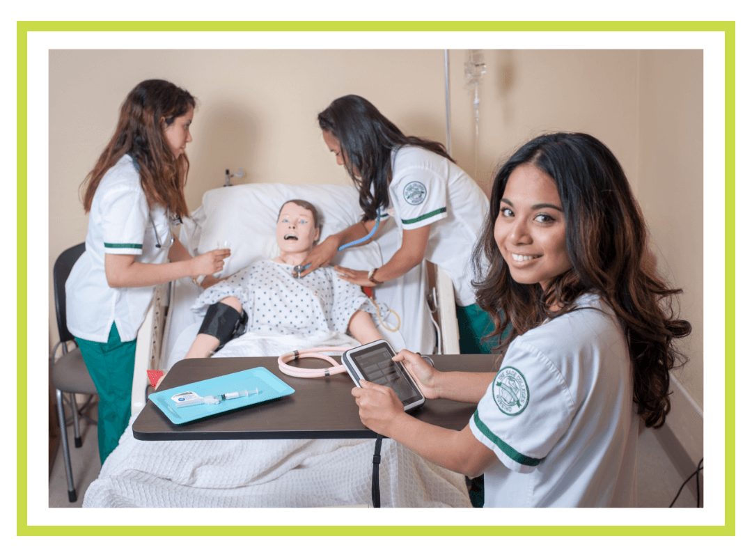 Nursing students working with a practice patient.